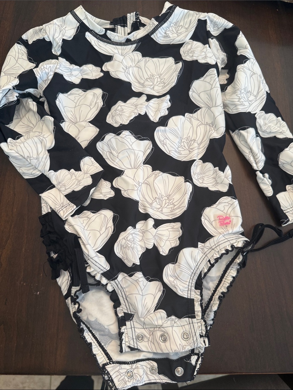 Ruffle Butts Black and White Floral Long-Sleeve One-Piece swimsuit